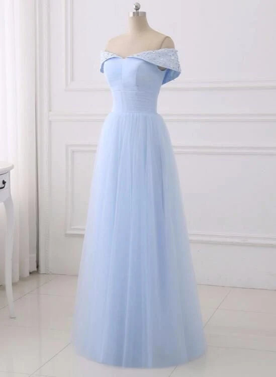 A light blue dress with a one shoulder design and lace decorations on the shoulders, suitable for dinner parties