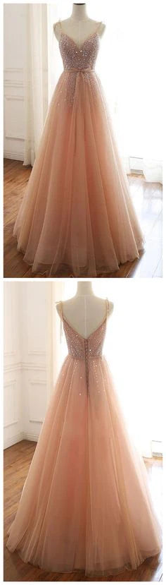 A light pink mesh dress with a suspender design and upper body adorned with sequins and rhinestones, suitable for occasions such as dinners and weddings