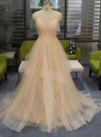 Naked pink wedding dress with deep V-neck straps and tight upper body design