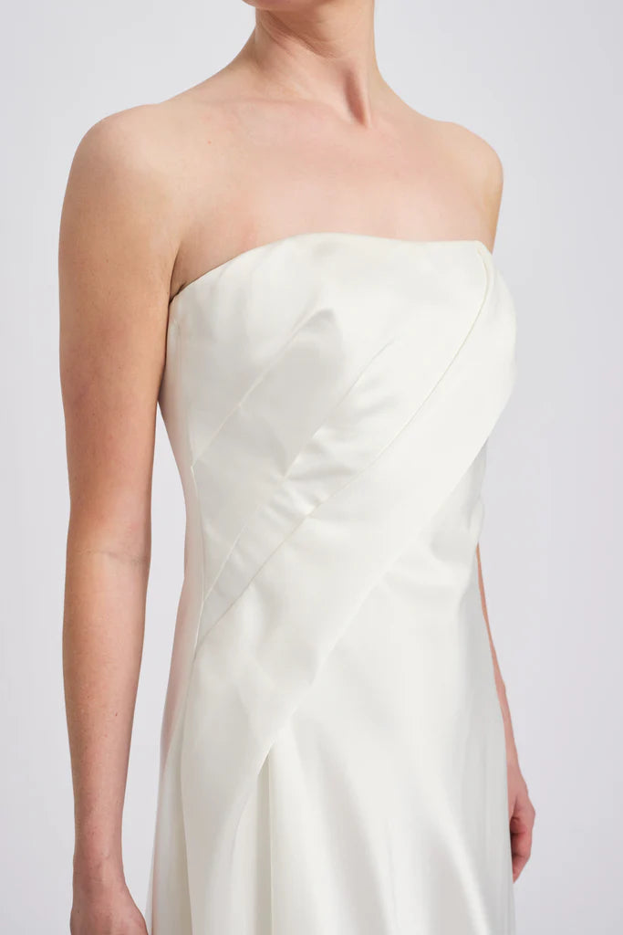 Fluid satin asymmetric handkerchief strapless dressShown in Ivory Simple atmo spheric beautiful and unique desig