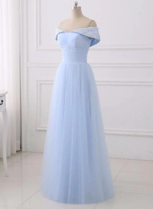 A light blue dress with a one shoulder design and lace decorations on the shoulders, suitable for dinner parties