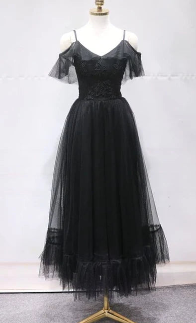 Black off shoulder long dress with suspender design, featuring sheer ruffles on the off shoulder for formal occasions such as dinners and parties