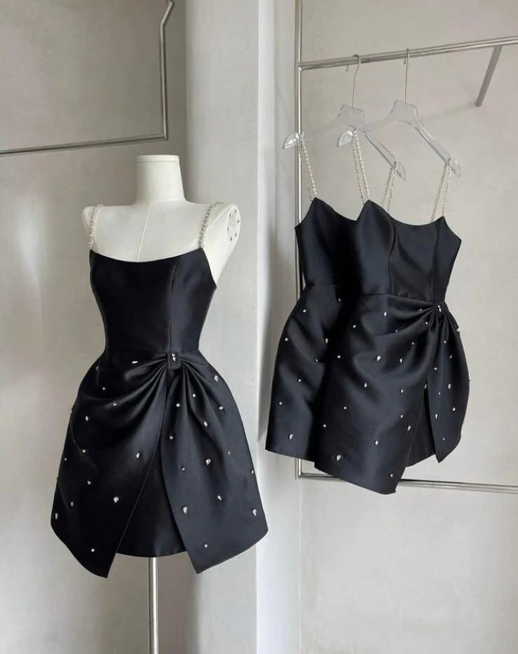 Black satin camisole skirt with rhinestone shoulder straps, exquisite skirt hem with bow and irregular cut adorned with rhinestones