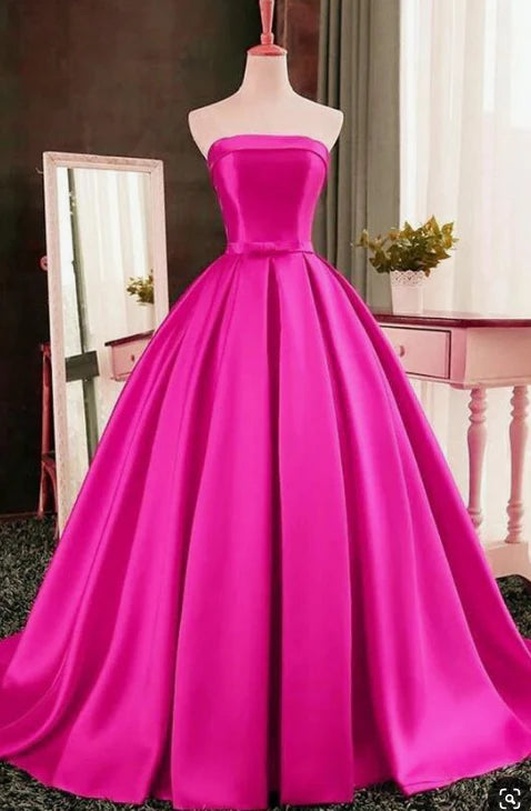 Bright pink strapless long dress with strapless design and bow decoration at the waist, suitable for dinners, parties, etc