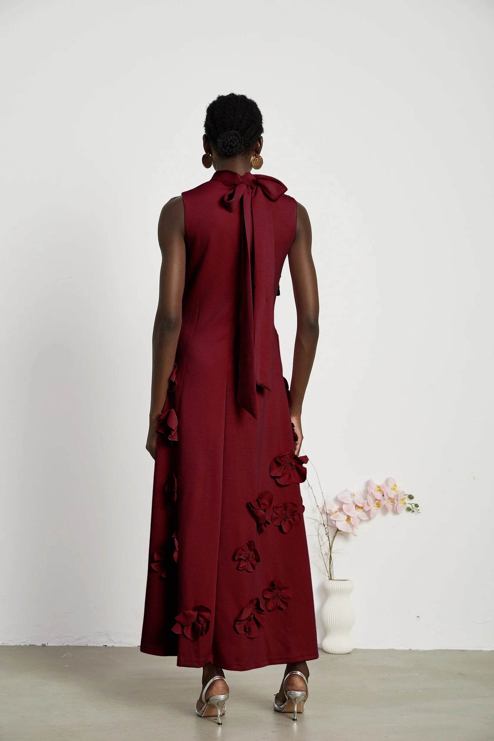 Burgundy Floral Applique Tie - Back Maxi Dress Red Sleeveless Maxi Dress with Faux Flower & Bow-Tie Embellishment Evening Dress
