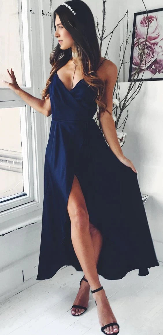 Deep blue camisole long dress with a deep V-neck design and high slit on the side, suitable for formal occasions such as dinners and parties.