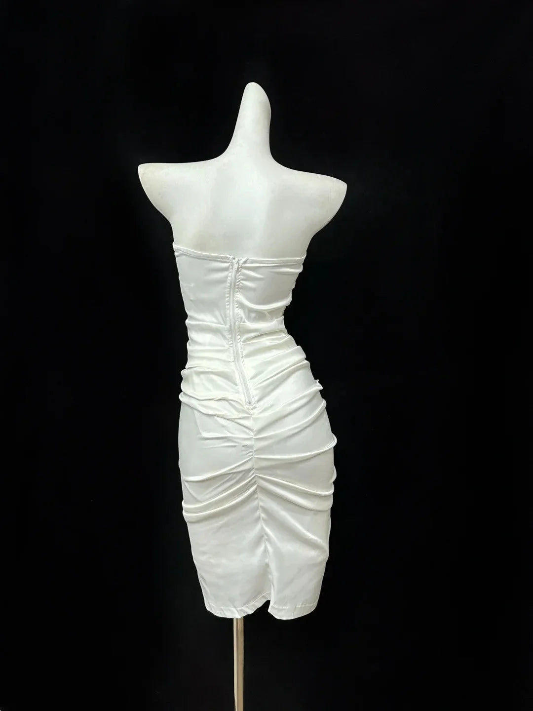 Elegant white strapless embroidered slim skirt with pleated slit design showcasing sexy charm