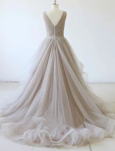 Light gray wedding dress with sleeveless deep V-neck and cross pleated upper body design for occasions such as dinners