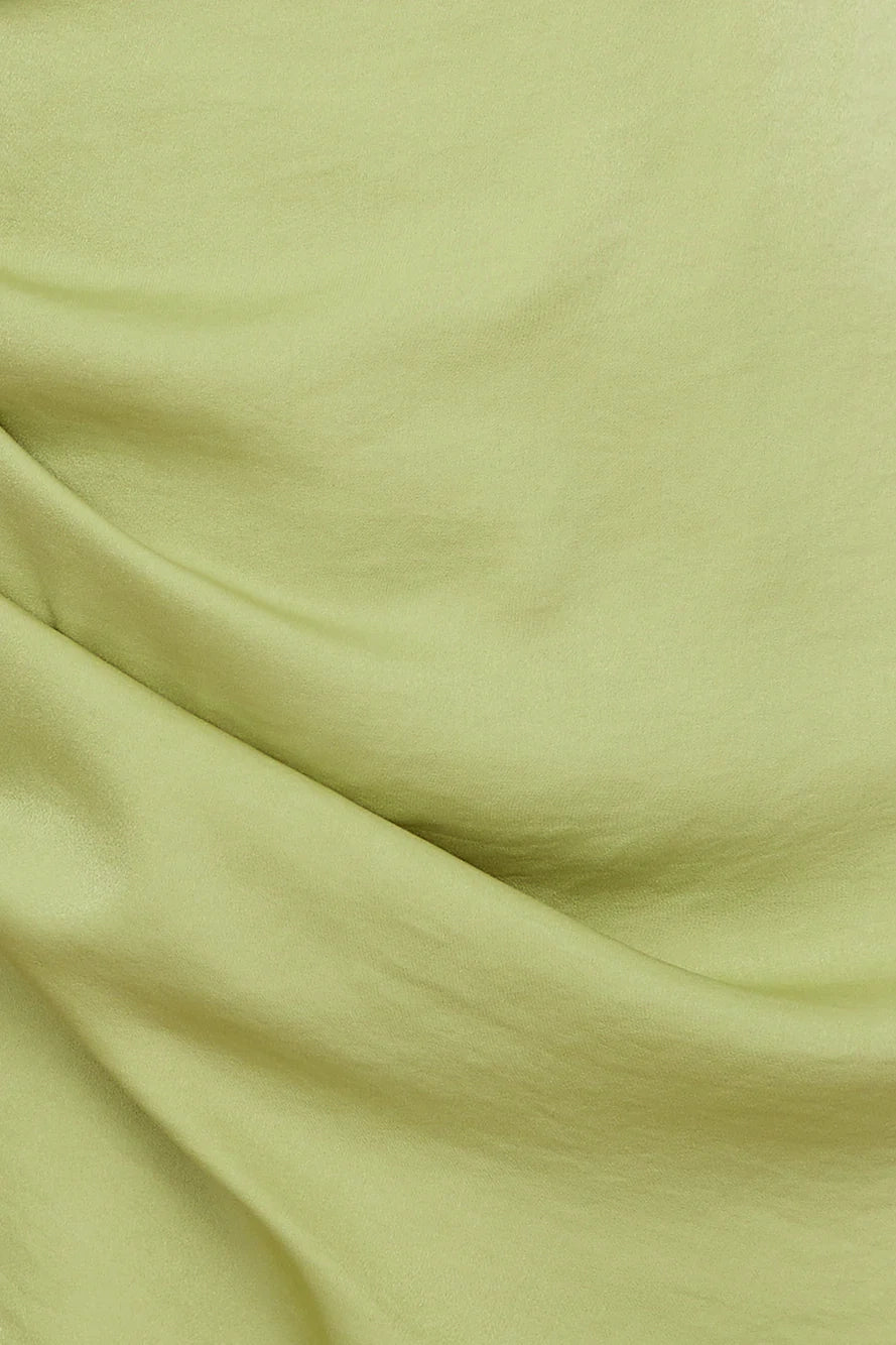 Light green sleeveless short dress with a hanging neckline and a pleated and irregular cut suitable for parties dates etc