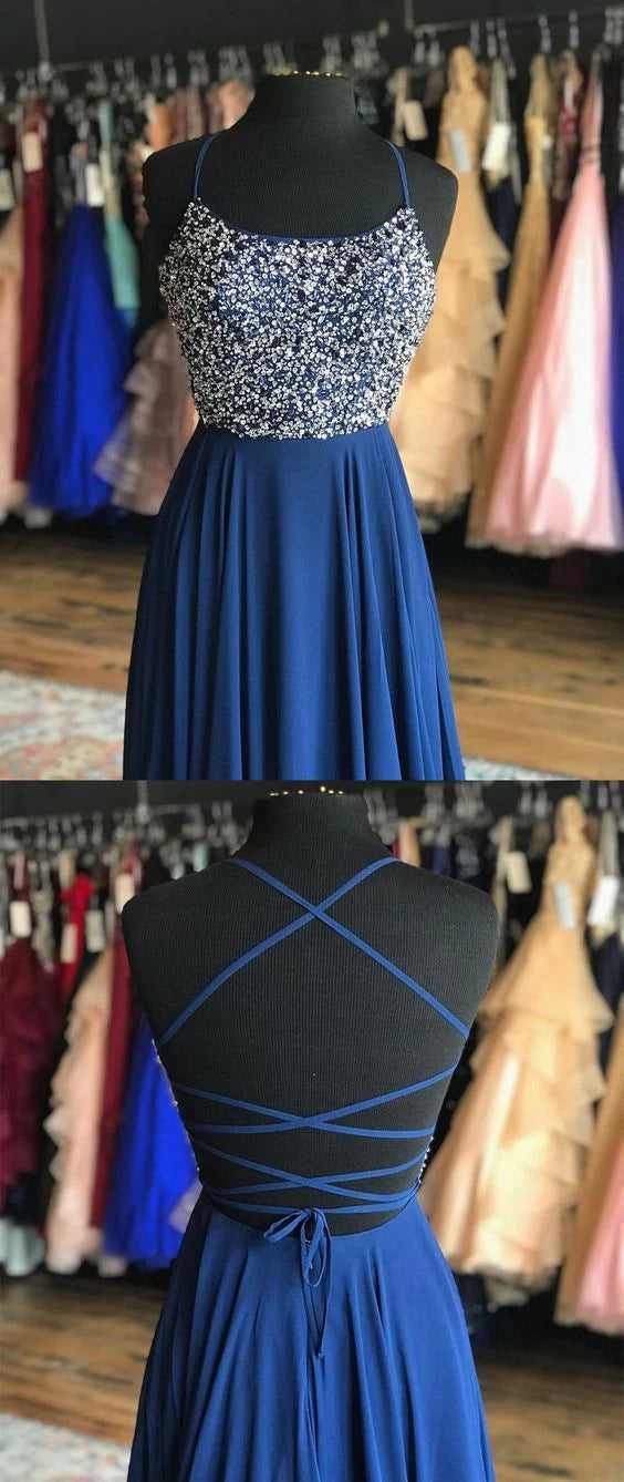 Long suspender dress with sequins or bead decorations on the upper body and a flowing deep blue skirt on the lower body, suitable for dinners, dances, etc