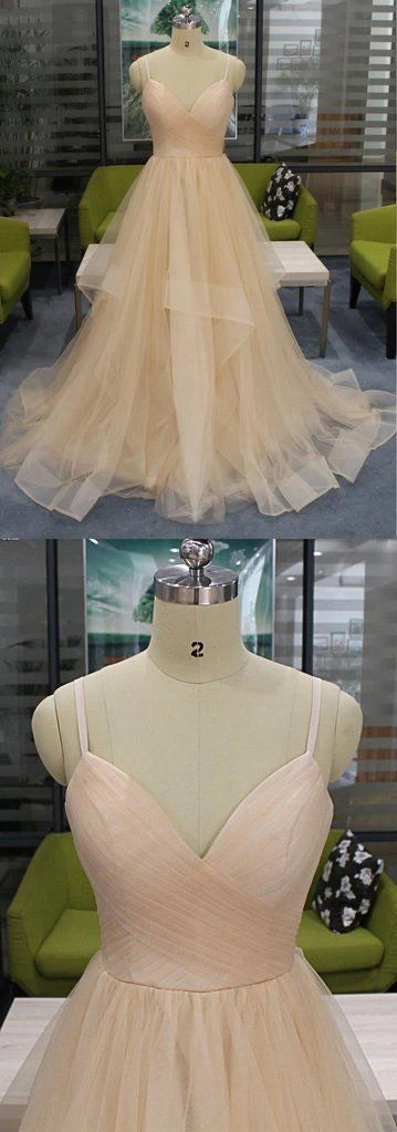 Naked pink wedding dress with deep V-neck straps and tight upper body design