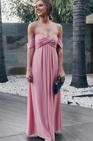 Pink off shoulder long dress with off shoulder design and twisted elements on the upper body, suitable for weddings, dinners, etc