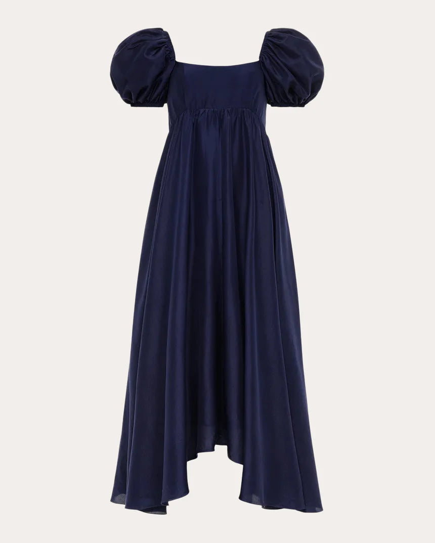 The raw silk silhouette falls in gathered form from its empire waistline to asymmetric midi hem simple gentle atmospheric and unique desi Bring summer colors to enhance whiteness