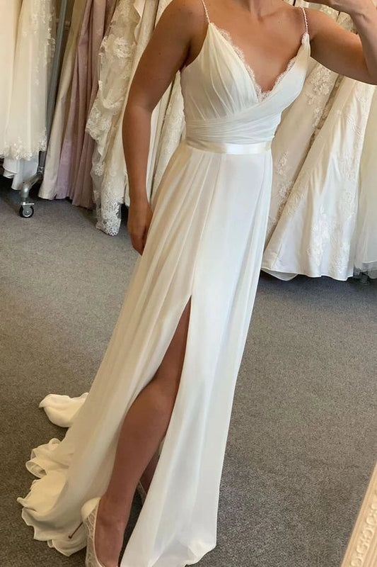 White camisole with deep V-neck and lace cross pleated design, high waisted split hem with trailing edge