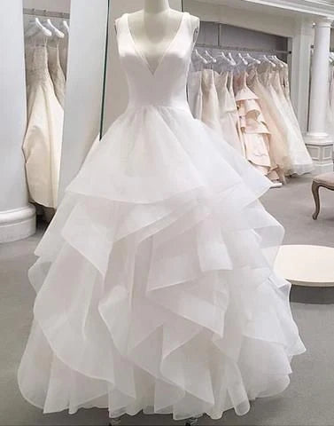 White deep V-neck sleeveless design with high waisted multi-layer organza skirt,