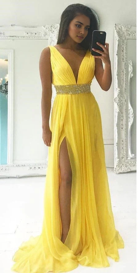 Yellow long sleeveless dress with deep V-neckline suitable for dinners, dances, parties, etc
