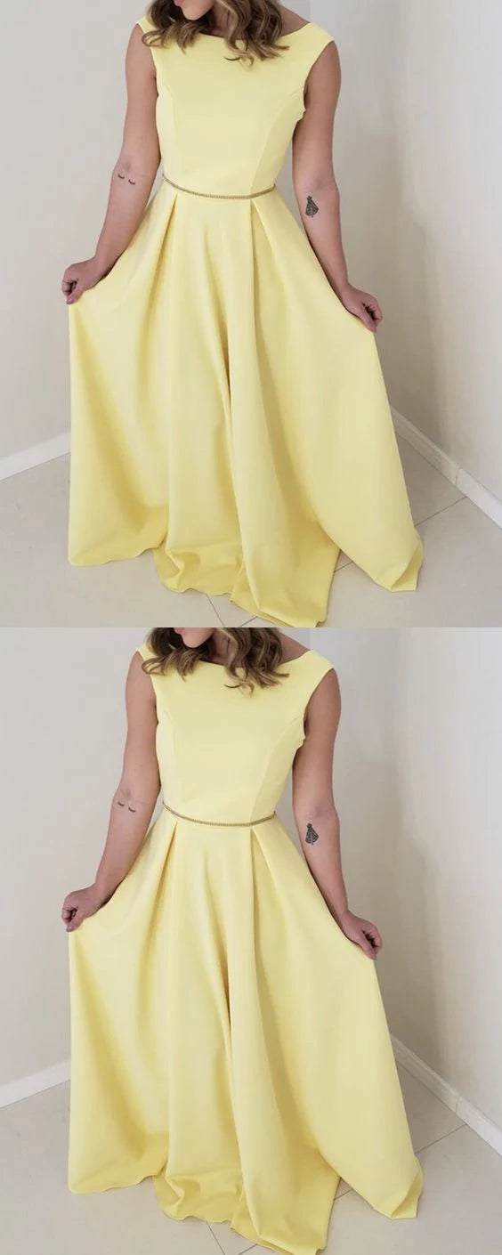 Yellow sleeveless long skirt with boat shaped neckline, thin waistband, and large skirt suitable for dinner parties
